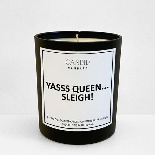 Funny Christmas Scented Candle with white label saying 'Yasssss Queen....Sleigh!' on glass jar