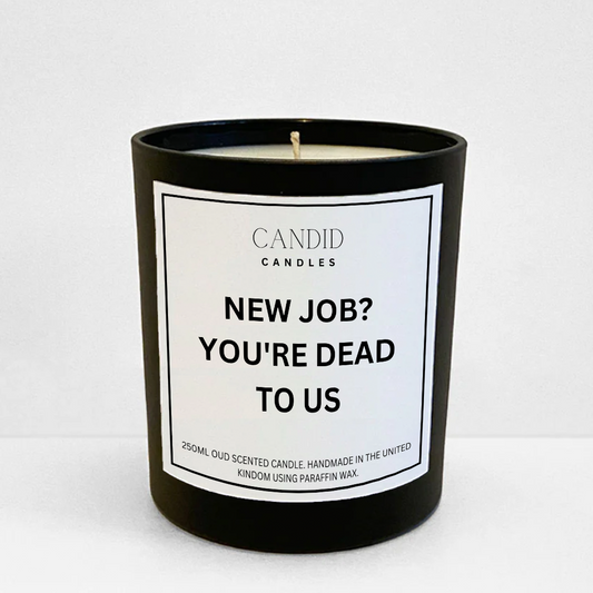 Funny oud scented candle in glass jar with white label text "New Job? You're Dead To Us"