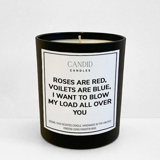 Rude funny candle labelled "Roses Are Red, Violets Are Blue, I Want To Blow My Load All Over You" on black jar