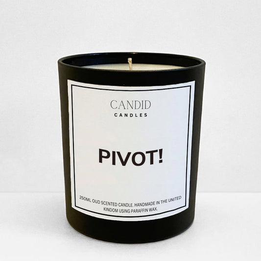 friends funny scented candle with white label "PIVOT!" on black glass jar